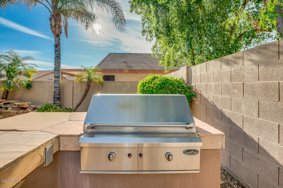 708 South Riata Street Gilbert, AZ 85296 - Photo 45 of 52 an aerial view of a house with a garden