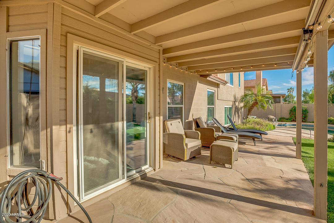 708 South Riata Street Gilbert, AZ 85296 - Photo 47 of 52 a view of a porch with a table and chairs