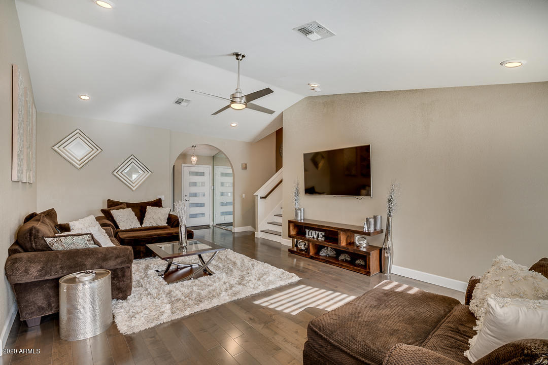 708 South Riata Street Gilbert, AZ 85296 - Photo 10 of 52 a living room with furniture and a flat screen tv