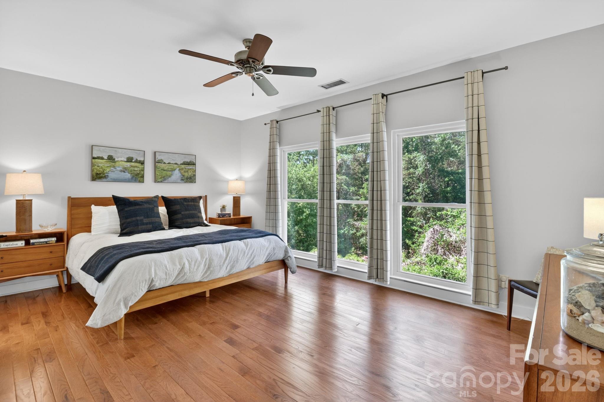 1011 Clearbrook Road Matthews, NC 28105 - Photo 17 of 46 a bedroom with a large bed and a large window