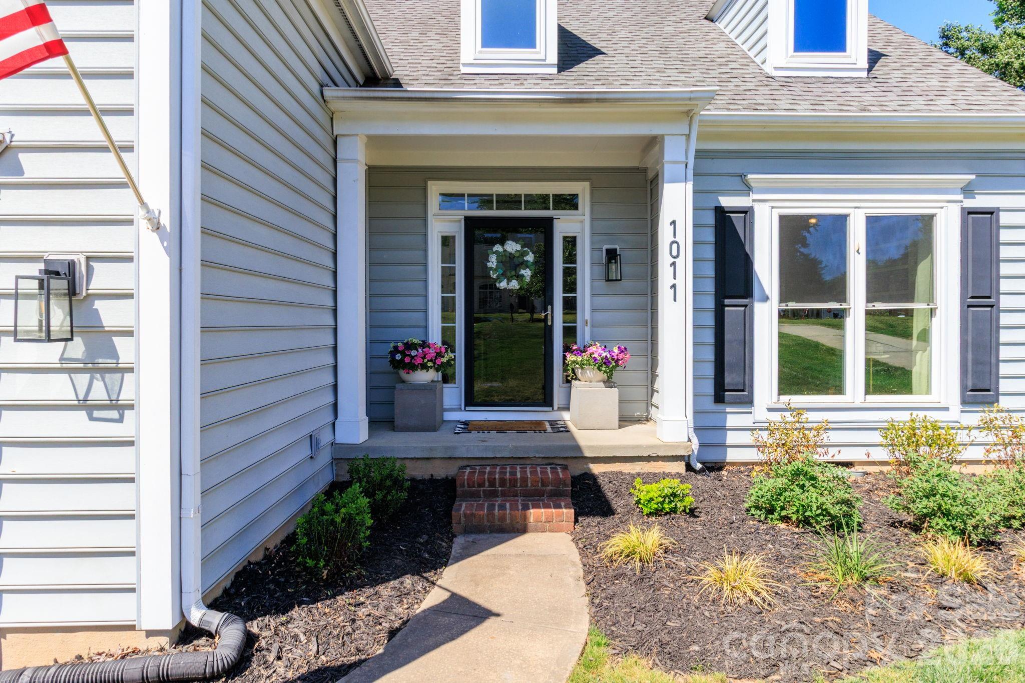 1011 Clearbrook Road Matthews, NC 28105 - Photo 2 of 46 a front view of a house with a yard