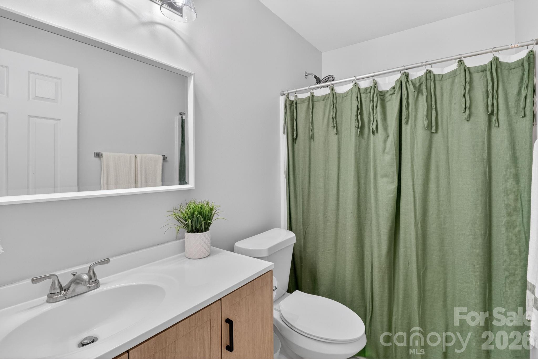 1011 Clearbrook Road Matthews, NC 28105 - Photo 26 of 46 a bathroom with a sink toilet and shower