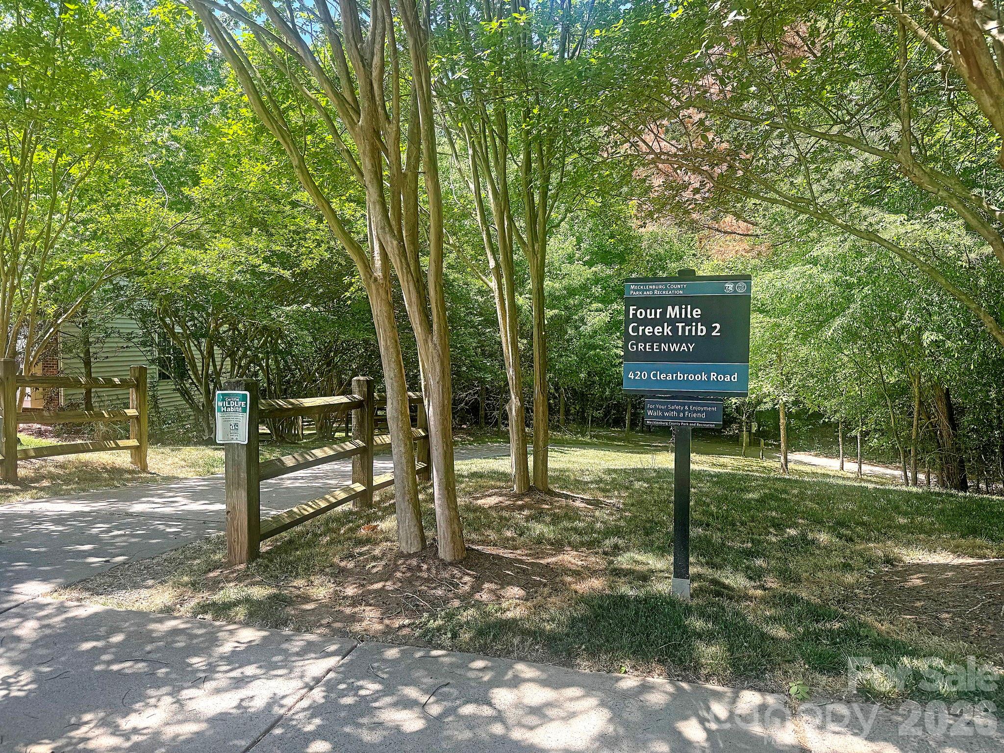 1011 Clearbrook Road Matthews, NC 28105 - Photo 39 of 46 a sign board with a yard