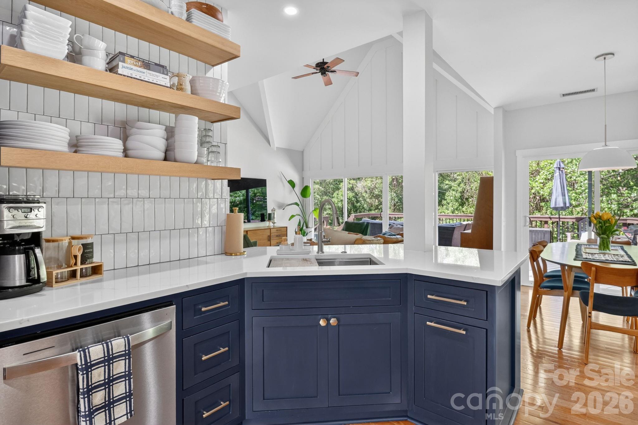 1011 Clearbrook Road Matthews, NC 28105 - Photo 7 of 46 a kitchen with a sink a window and cabinets