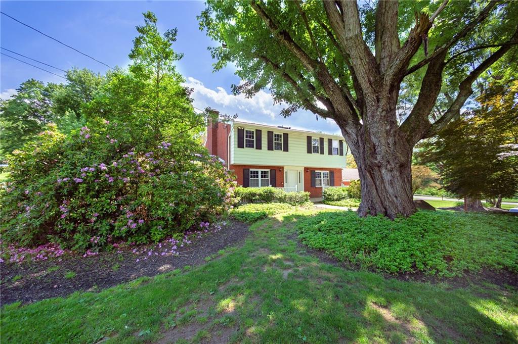 2387 Harrison City Road Export, PA 15632 - Photo 11 of 25 a front view of a house with garden