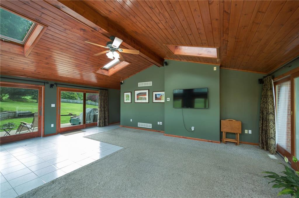 2387 Harrison City Road Export, PA 15632 - Photo 12 of 25 a view of a livingroom with a ceiling fan and window