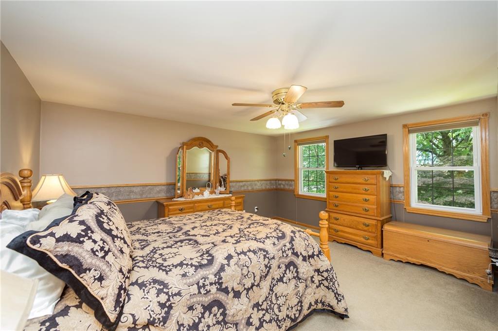 2387 Harrison City Road Export, PA 15632 - Photo 14 of 25 a bedroom with a bed and a flat screen tv
