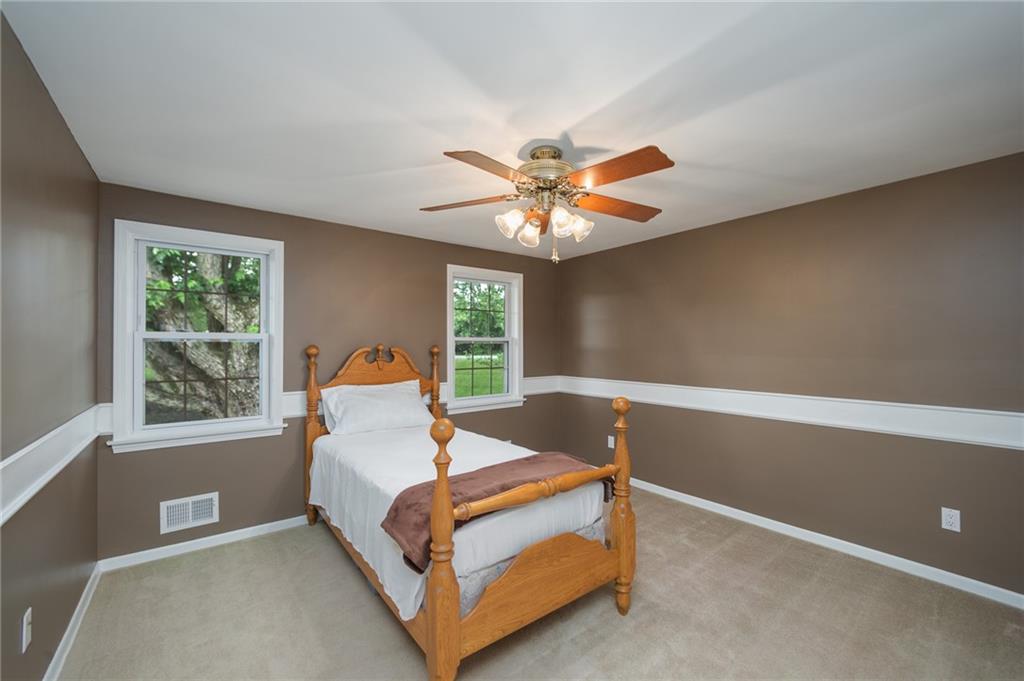 2387 Harrison City Road Export, PA 15632 - Photo 16 of 25 a bed room with a bed and a window