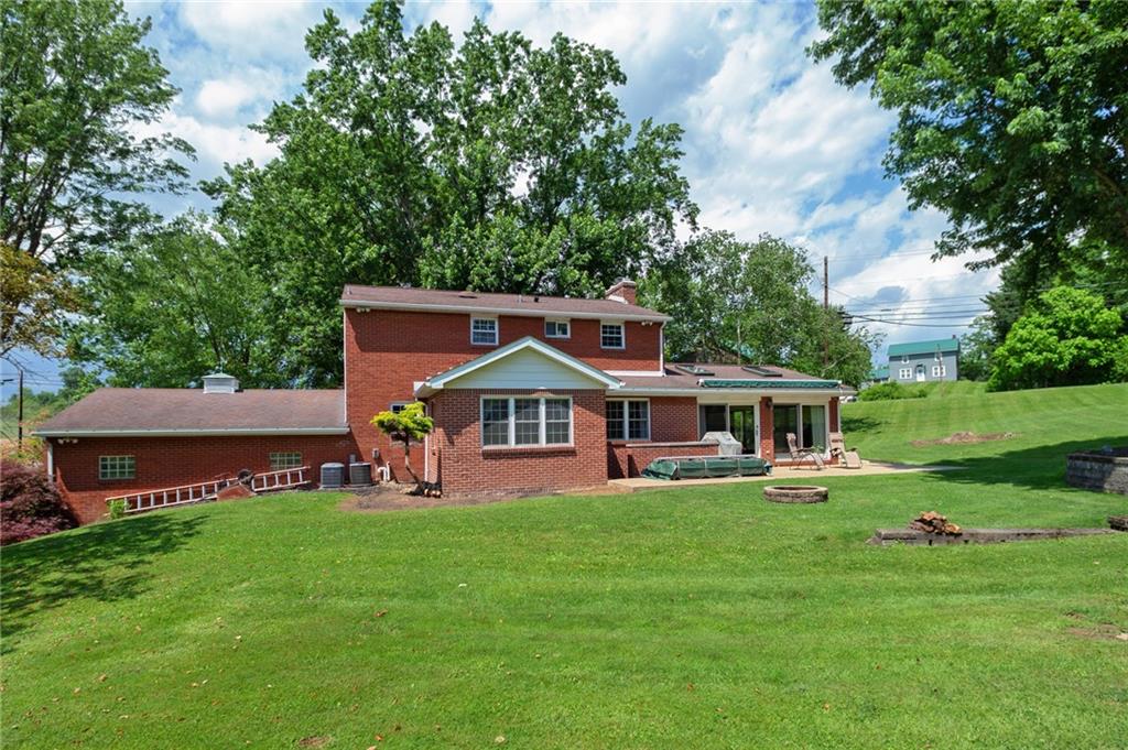 2387 Harrison City Road Export, PA 15632 - Photo 21 of 25 a view of a house with a yard deck and a large tree