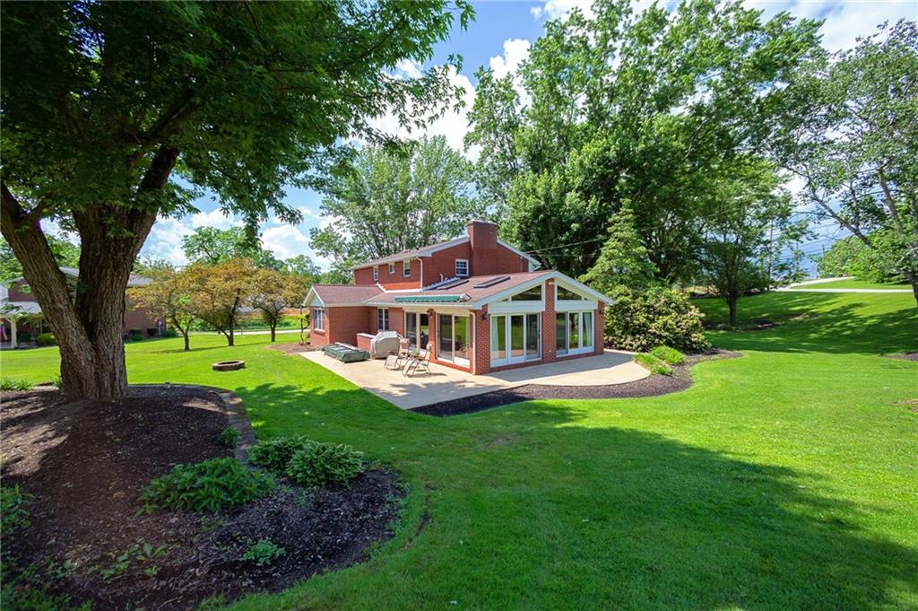 2387 Harrison City Road Export, PA 15632 - Photo 23 of 25 a front view of a house with garden