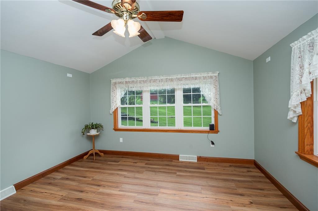 2387 Harrison City Road Export, PA 15632 - Photo 7 of 25 a view of an empty room with window and wooden floor