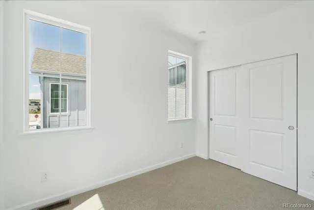 a picture of a bench in front of a building