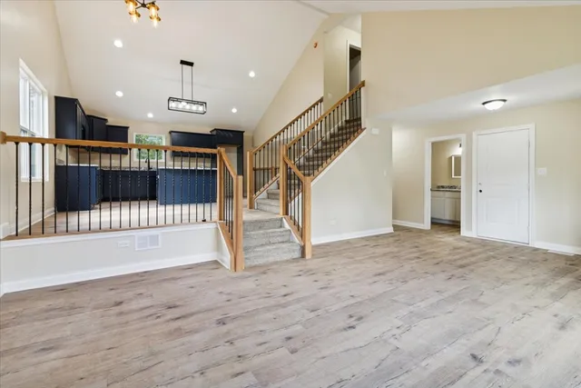 a view of entryway with stairs and a wooden floor