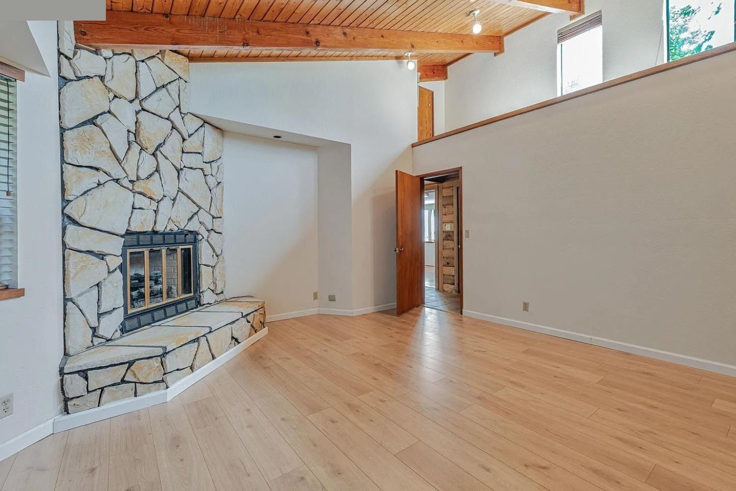 4607 Archerdale Road Linden, CA 95236 - Photo 21 of 50 an empty room with wooden floor and windows