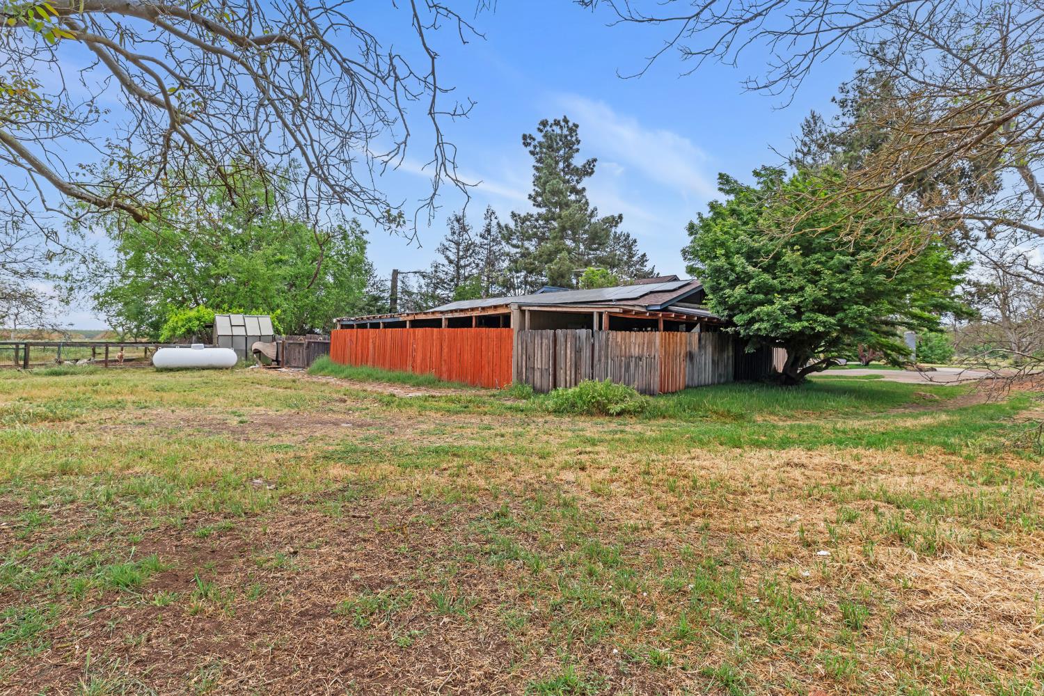 4607 Archerdale Road Linden, CA 95236 - Photo 28 of 50 a view of a house with backyard and tree