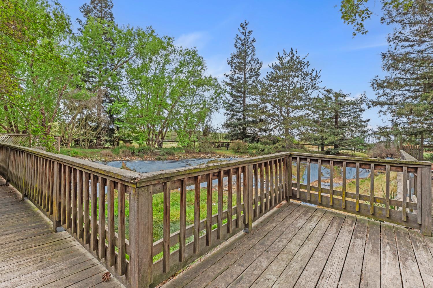 4607 Archerdale Road Linden, CA 95236 - Photo 34 of 50 a view of balcony with wooden floor and fence