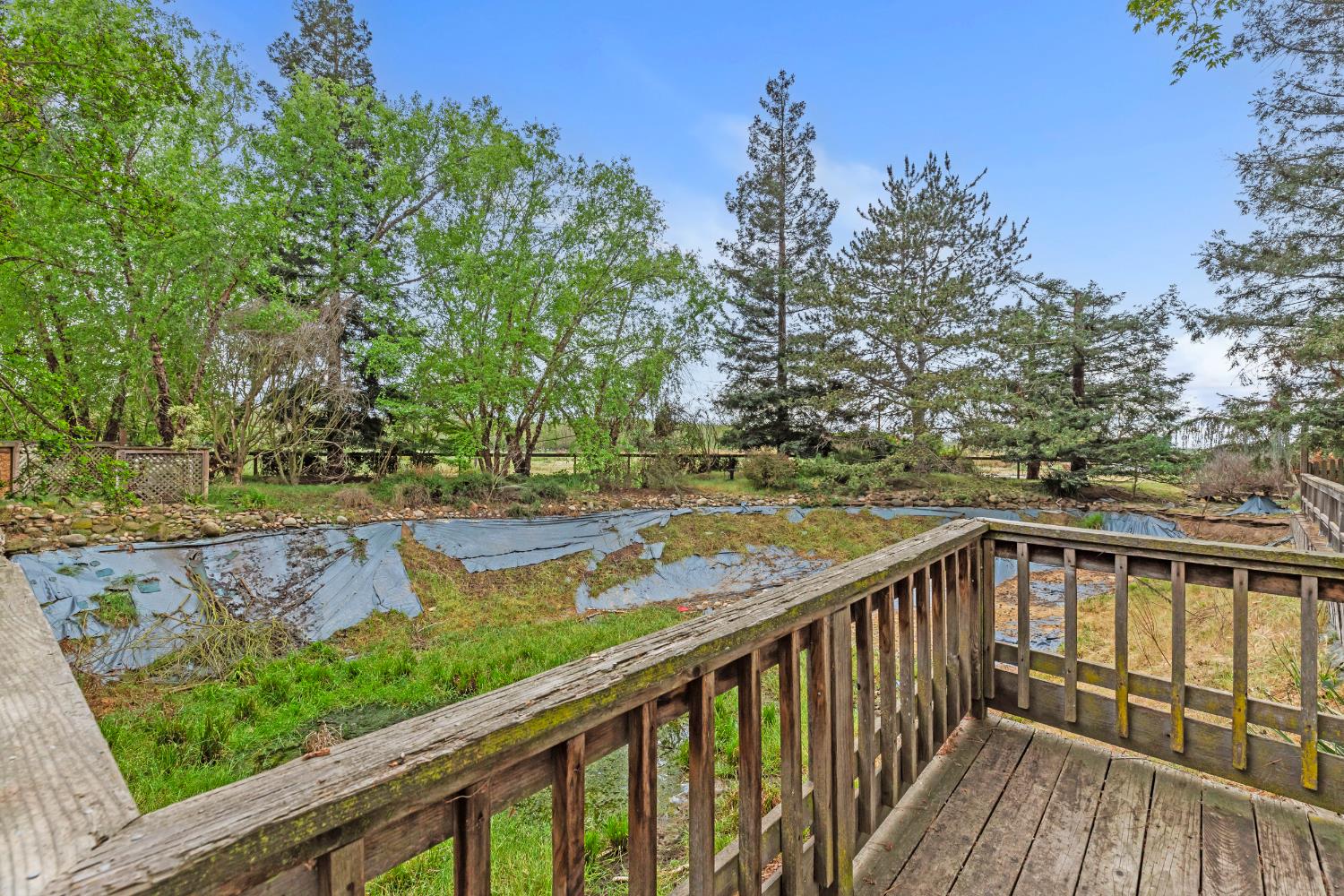 4607 Archerdale Road Linden, CA 95236 - Photo 35 of 50 a view of a wooden deck with a yard