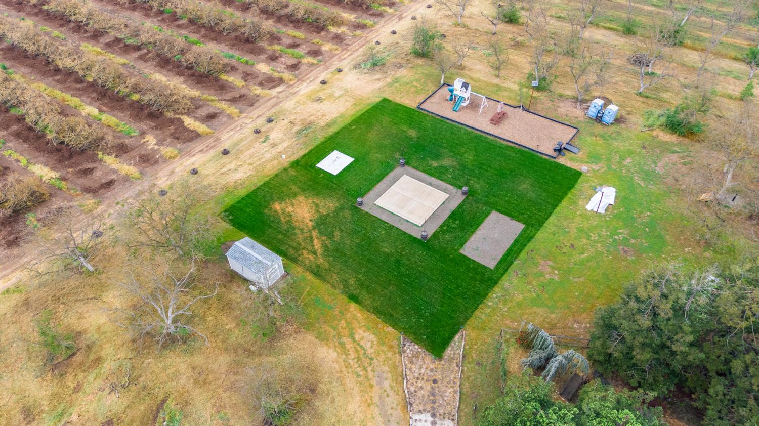 4607 Archerdale Road Linden, CA 95236 - Photo 39 of 50 a green field with lots of tress in it