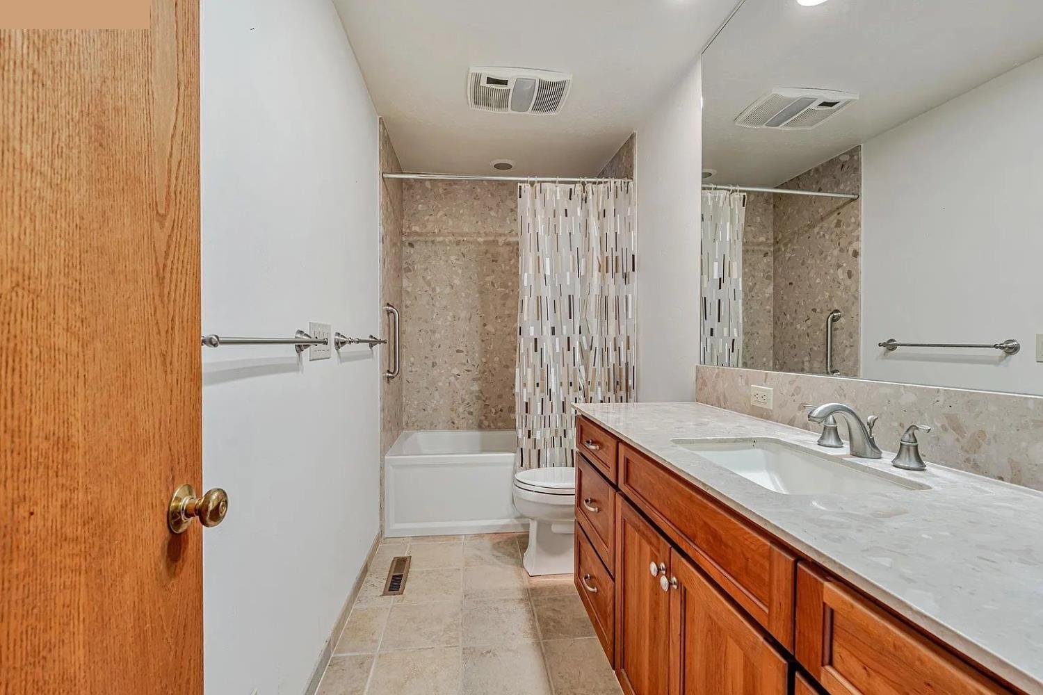 4607 Archerdale Road Linden, CA 95236 - Photo 48 of 50 a bathroom with a sink a toilet and shower