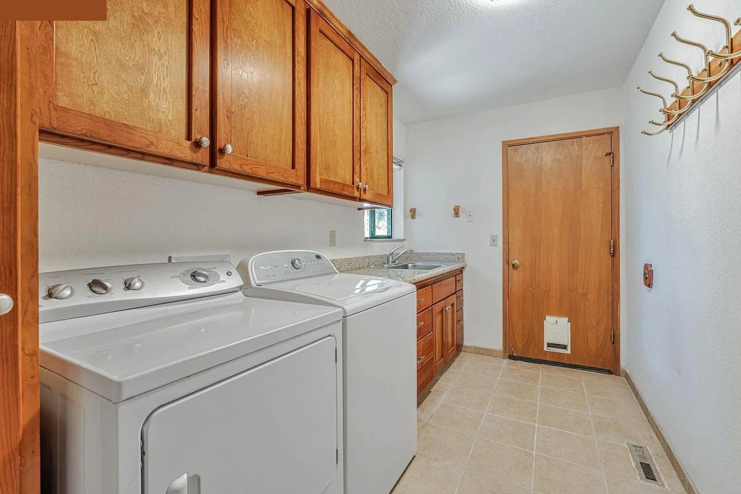 4607 Archerdale Road Linden, CA 95236 - Photo 50 of 50 a utility room with dryer and washer