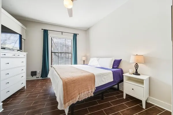 a bed room with a bed and a tv