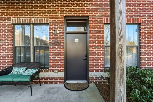 a view of a brick house with outdoor space
