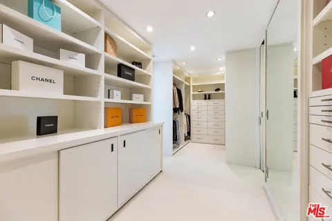 a view of an entryway with cabinets