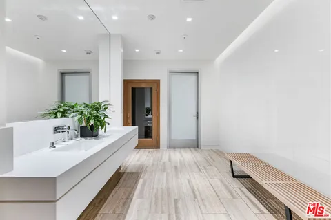 a bathroom with a sink and mirror