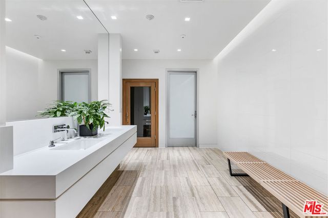 a bathroom with a sink and mirror