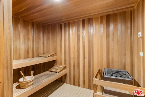a view of wooden floor and curtain in a closet