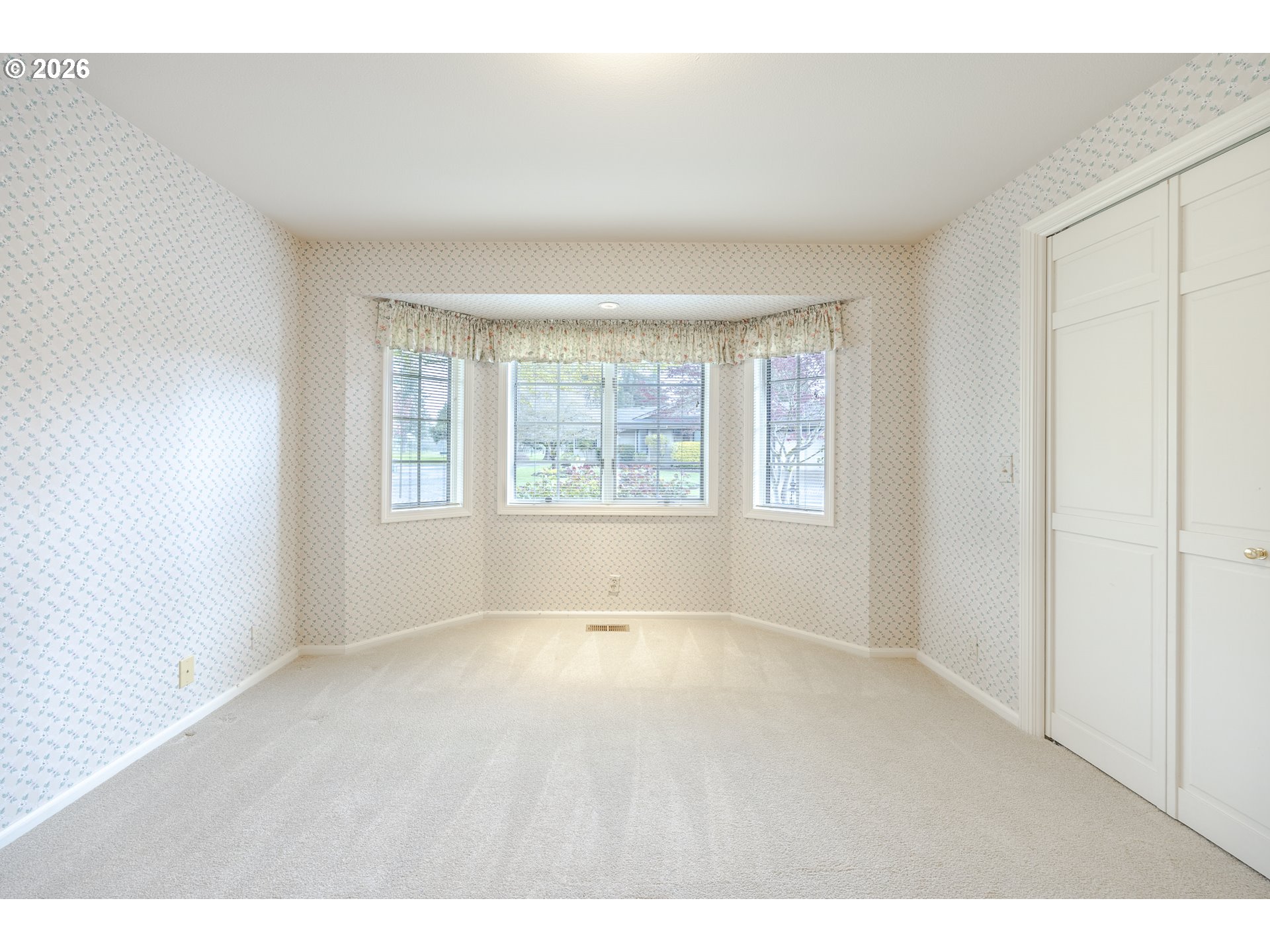 982 Shaughnessy Lane Eugene, OR 97401 - Photo 32 of 48 a view of an empty room with a window