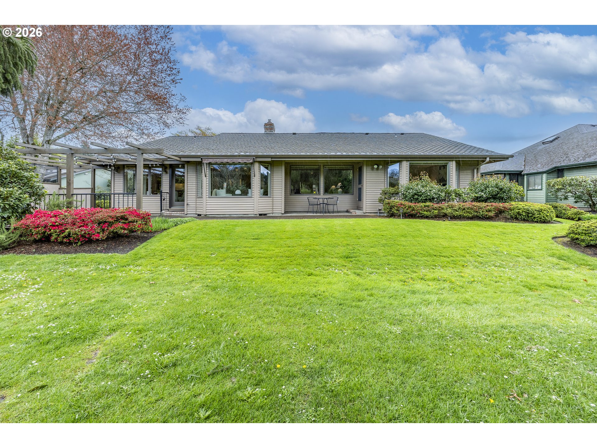 982 Shaughnessy Lane Eugene, OR 97401 - Photo 40 of 48 a front view of a house with a garden and porch