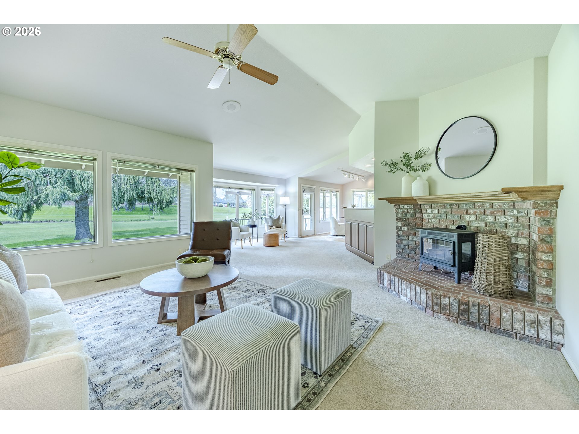 982 Shaughnessy Lane Eugene, OR 97401 - Photo 7 of 48 a living room with furniture a fireplace and a large window