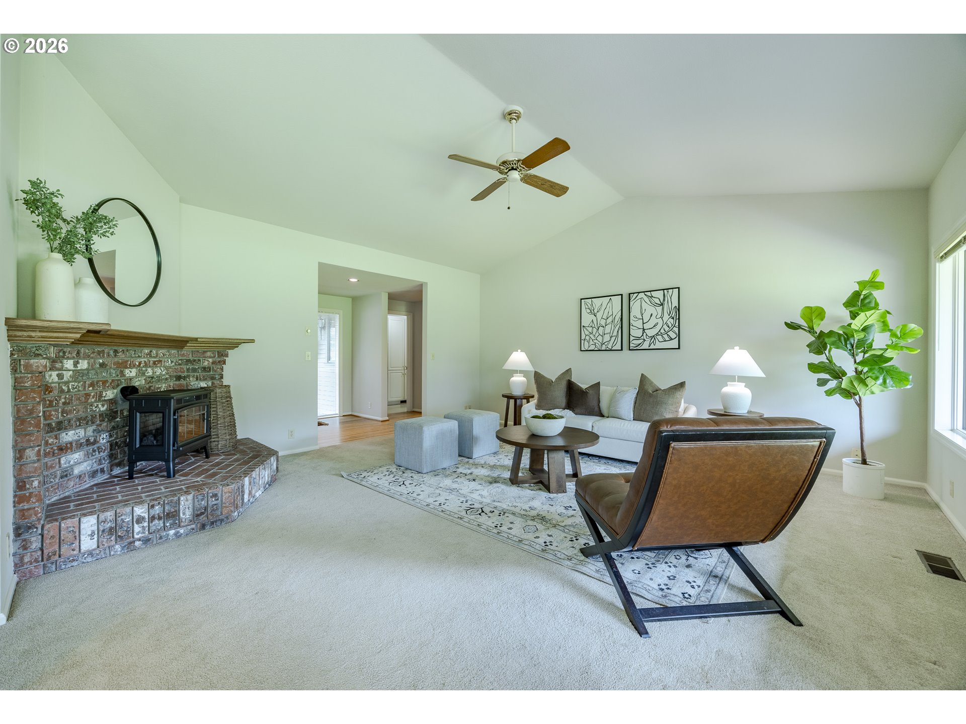 982 Shaughnessy Lane Eugene, OR 97401 - Photo 8 of 48 a living room with furniture a fireplace and a potted plant