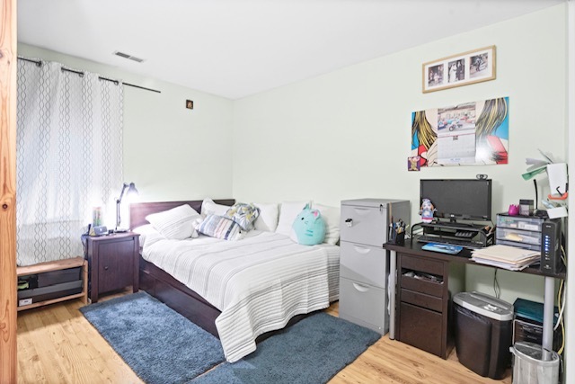 4704 Euclid Avenue, Unit 1B Rolling Meadows, IL 60008 - Photo 14 of 20 a bedroom with a bed and a couch