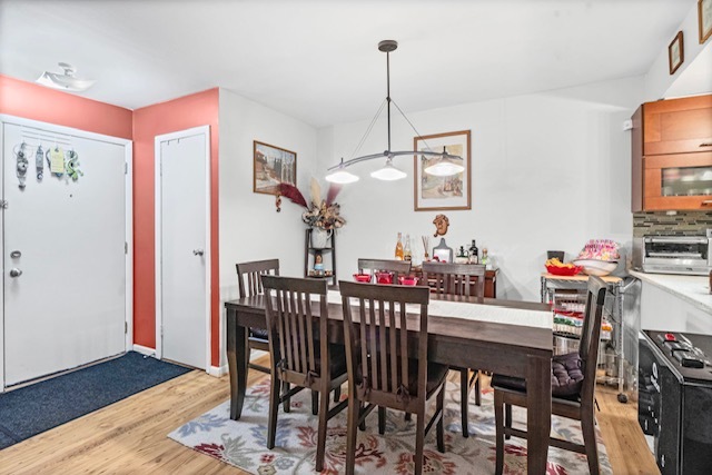 4704 Euclid Avenue, Unit 1B Rolling Meadows, IL 60008 - Photo 6 of 20 a view of a dining room with furniture and wooden floor