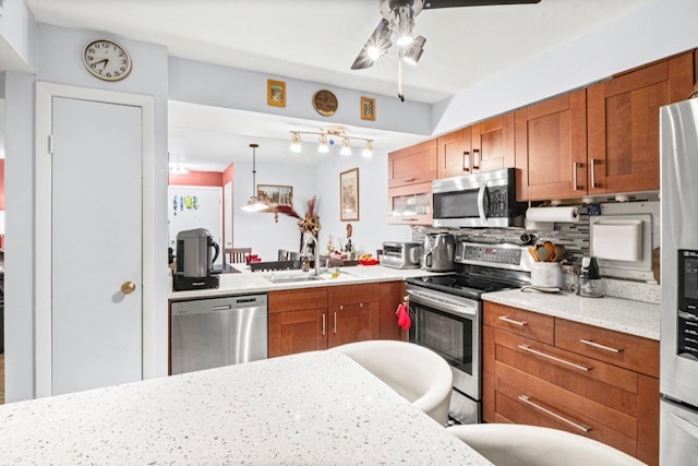 4704 Euclid Avenue, Unit 1B Rolling Meadows, IL 60008 - Photo 8 of 20 a kitchen with stainless steel appliances granite countertop a sink dishwasher stove refrigerator and cabinets with wooden floor