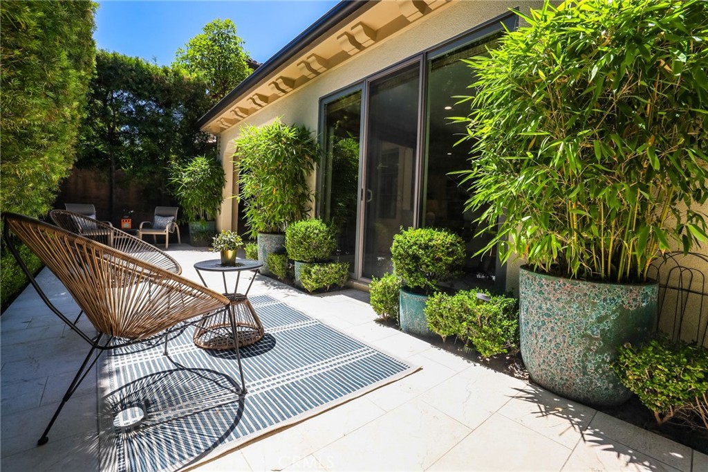 62 Wrangler Irvine, CA 92602 - Photo 53 of 61 a view of a patio with couches table and chairs and potted plants