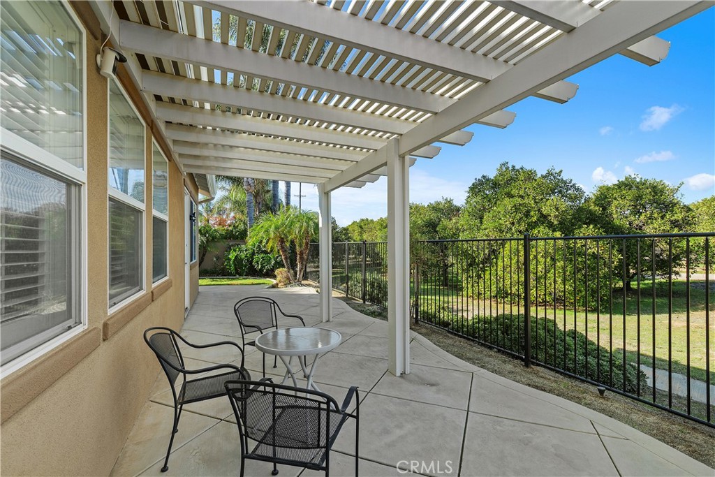 1195 Pamplona Drive Riverside, CA 92508 - Photo 32 of 39 The back patio has a lovely view of the citrus groves. There is also a gate in the fence so you can go into the groves to pick fruit. There are valencia and navel oranges available nearby and also lemon and grapefruit in other parts of the community.