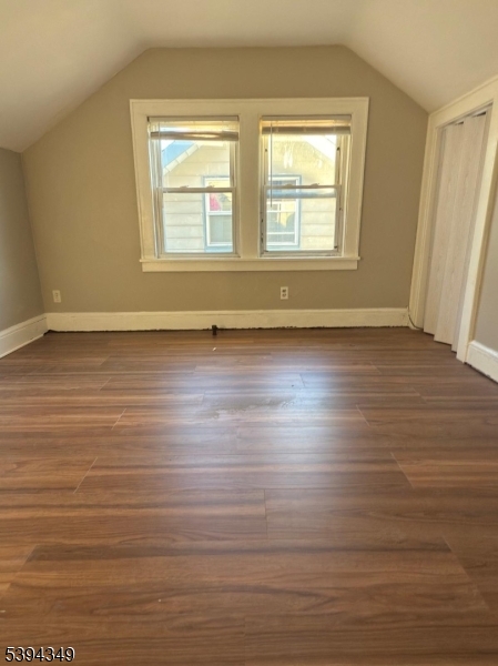 338 Union Avenue Irvington, NJ 07111 - Photo 2 of 8 an empty room with wooden floor and windows
