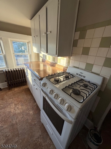 338 Union Avenue Irvington, NJ 07111 - Photo 7 of 8 a stove top oven sitting inside of a kitchen