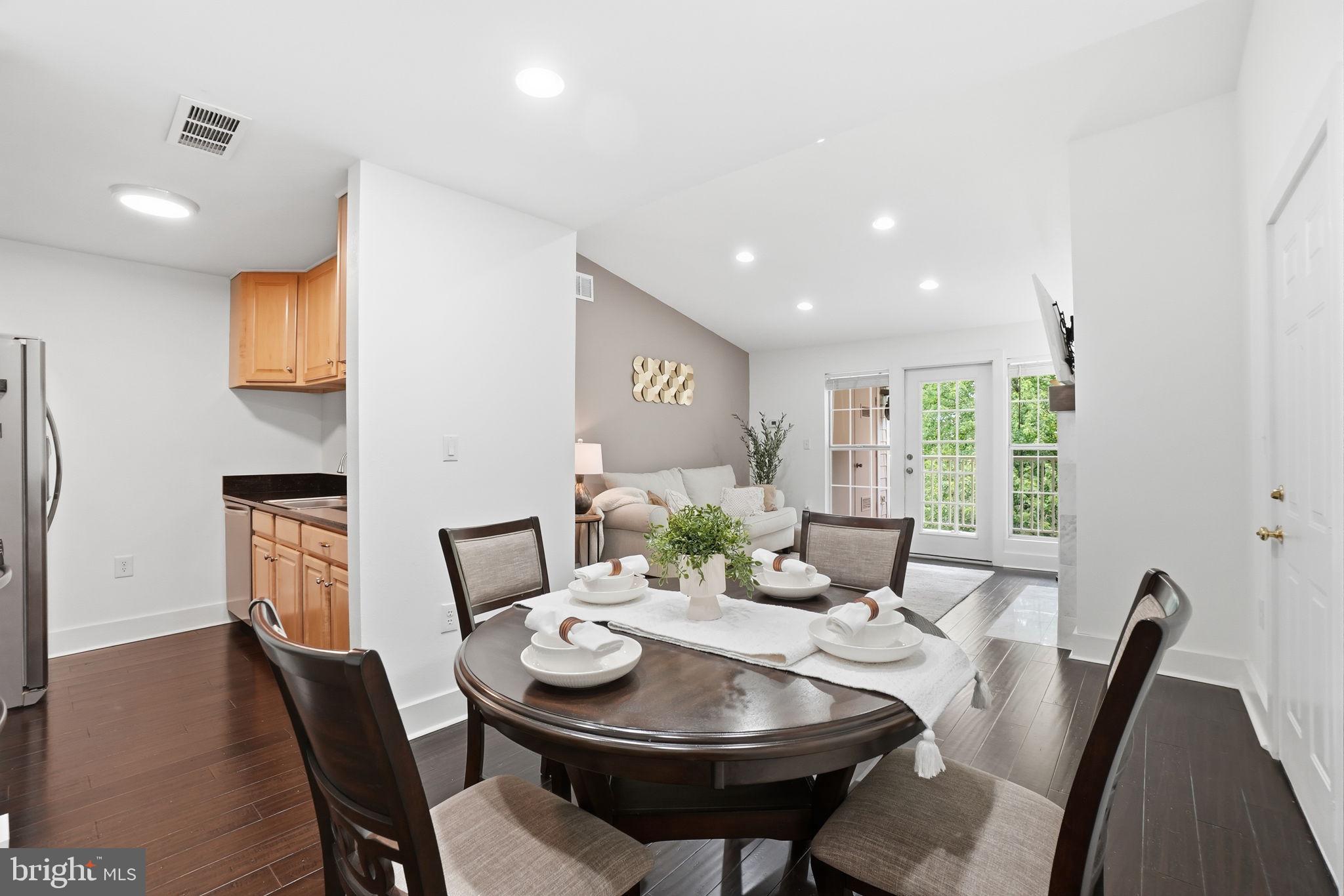 20960 Timber Ridge Terrace, Unit 303 Ashburn, VA 20147 - Photo 8 of 32 Kitchen, dining room and living room