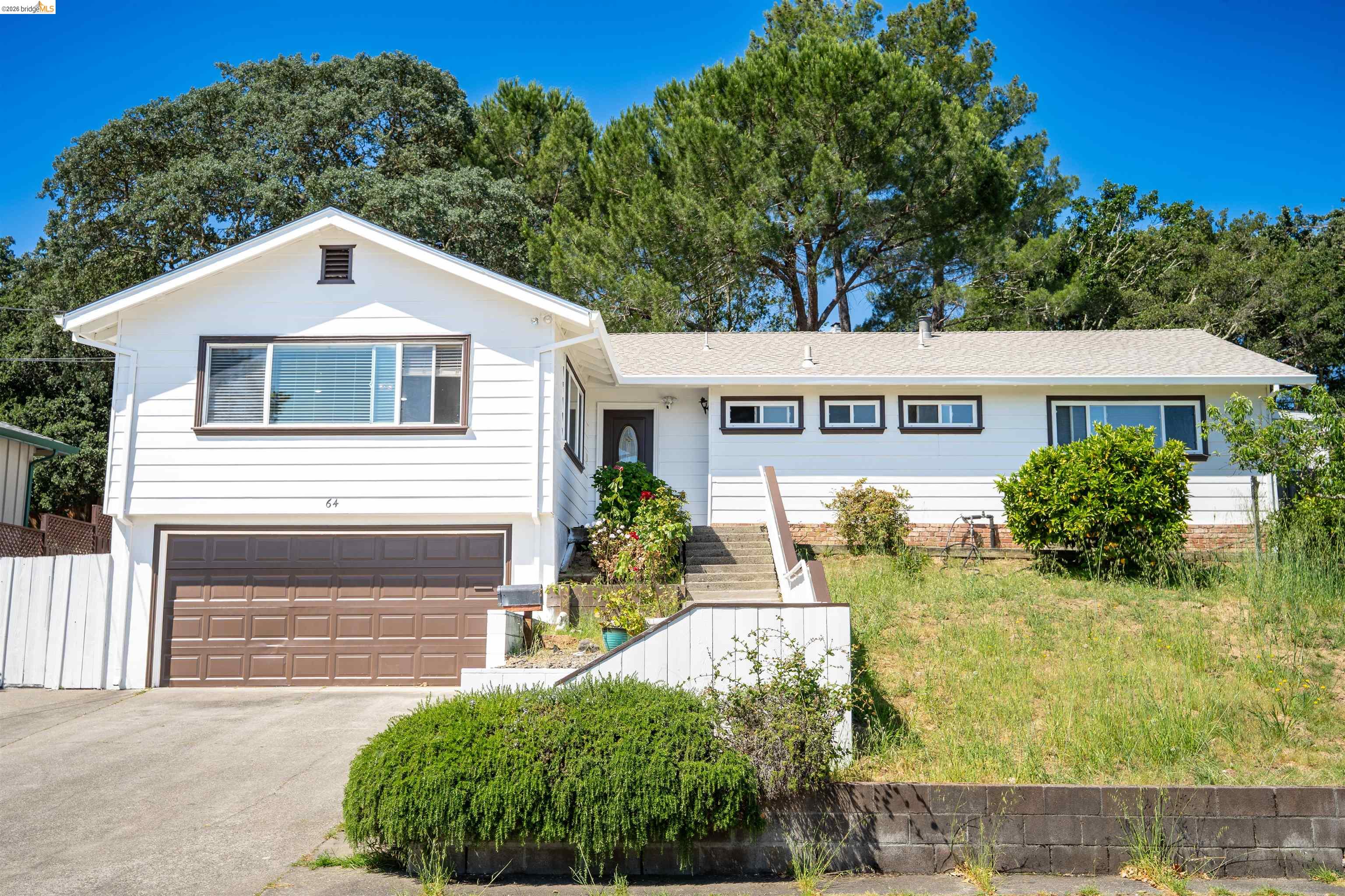 64 Washington Street Novato, CA 94947 - Photo 1 of 21 Single-story residence featuring white siding and a brown garage door
