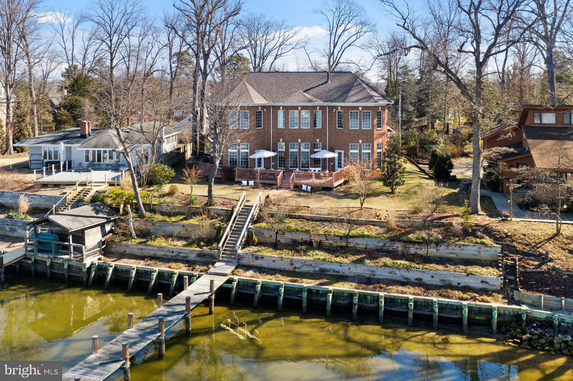 a view of a swimming pool with outdoor seating