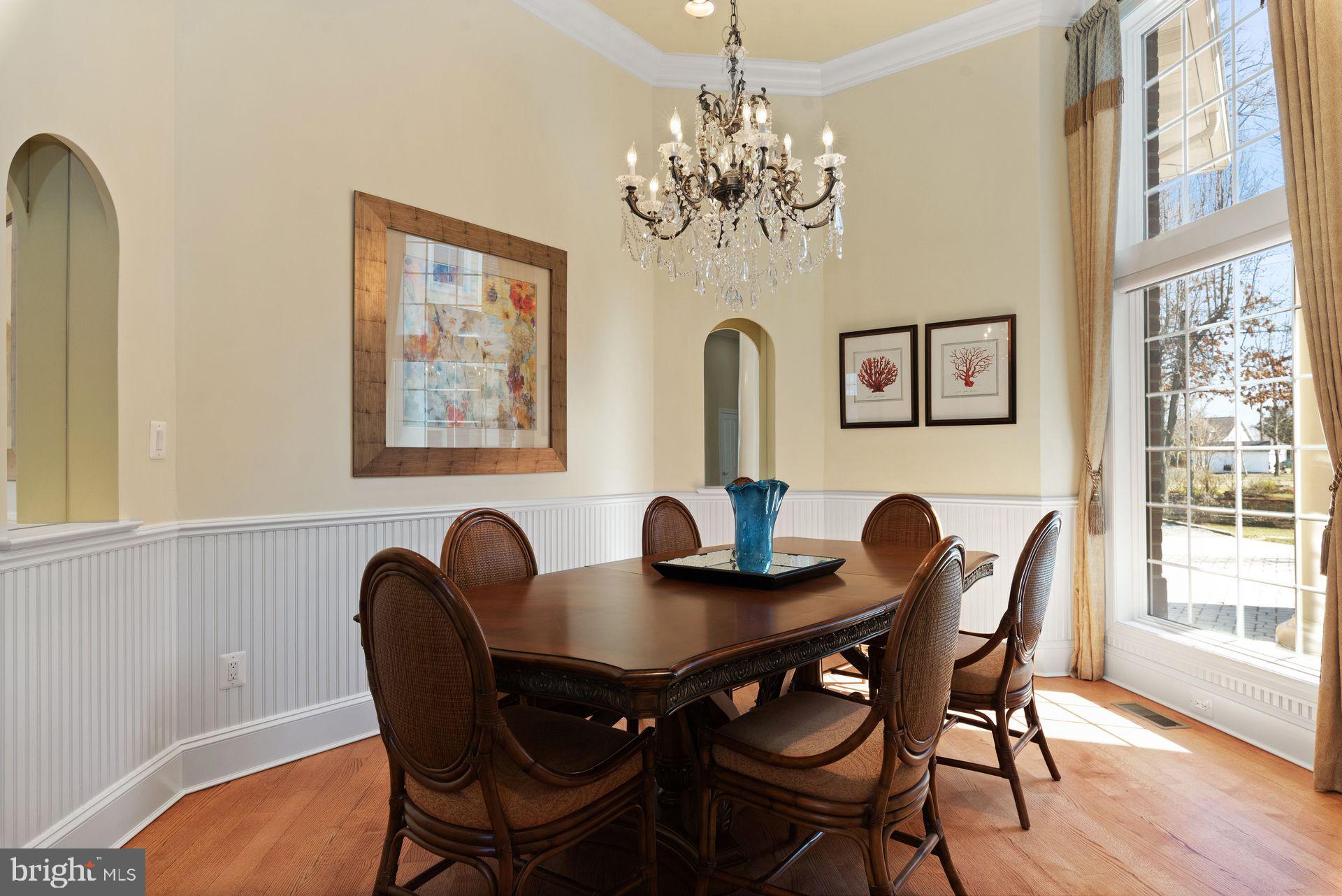 4132 Cadle Creek Road Edgewater, MD 21037 - Photo 19 of 85 a view of a dining room with furniture and chandelier