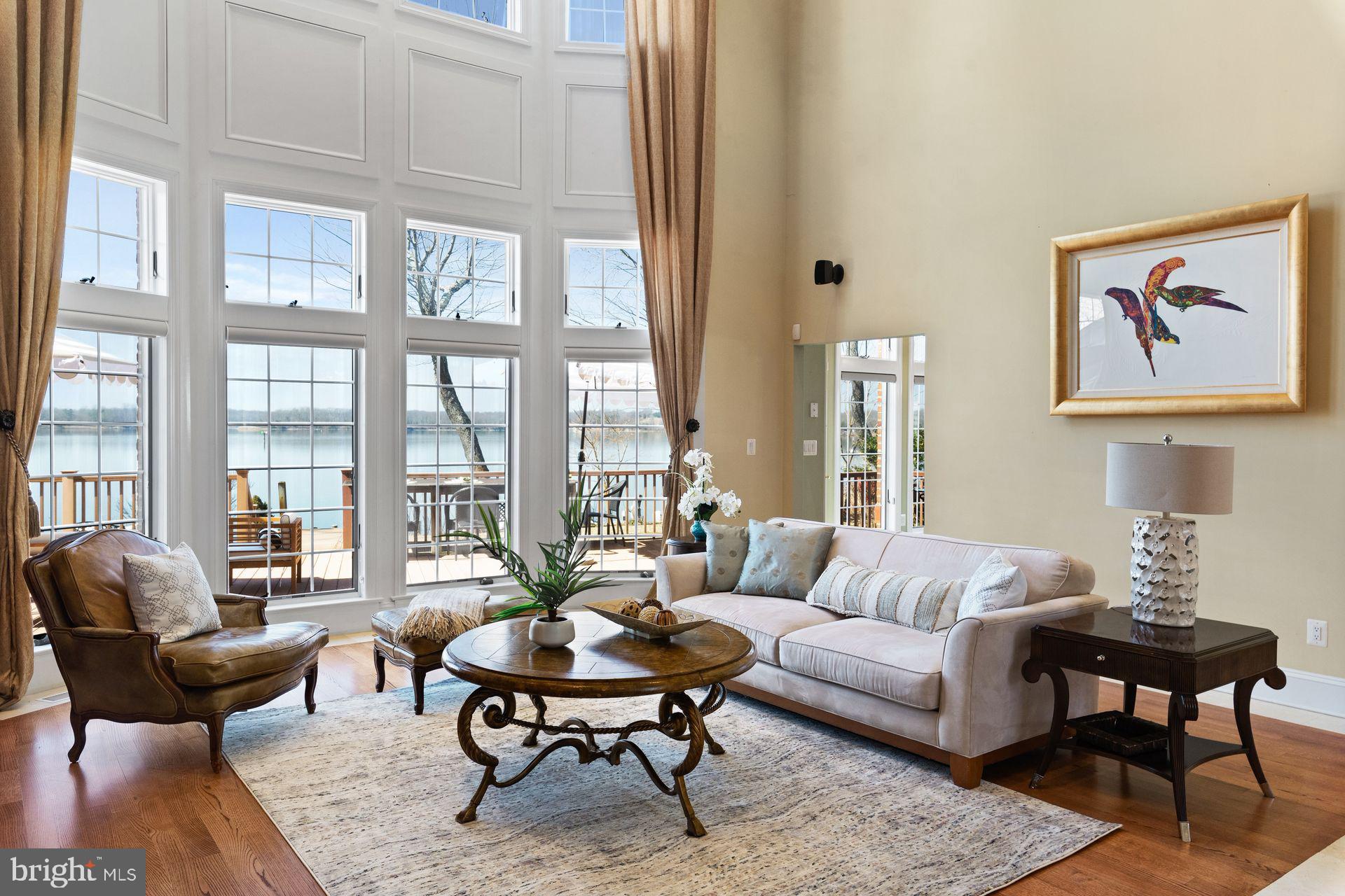 4132 Cadle Creek Road Edgewater, MD 21037 - Photo 3 of 85 a living room with furniture a table and a large window