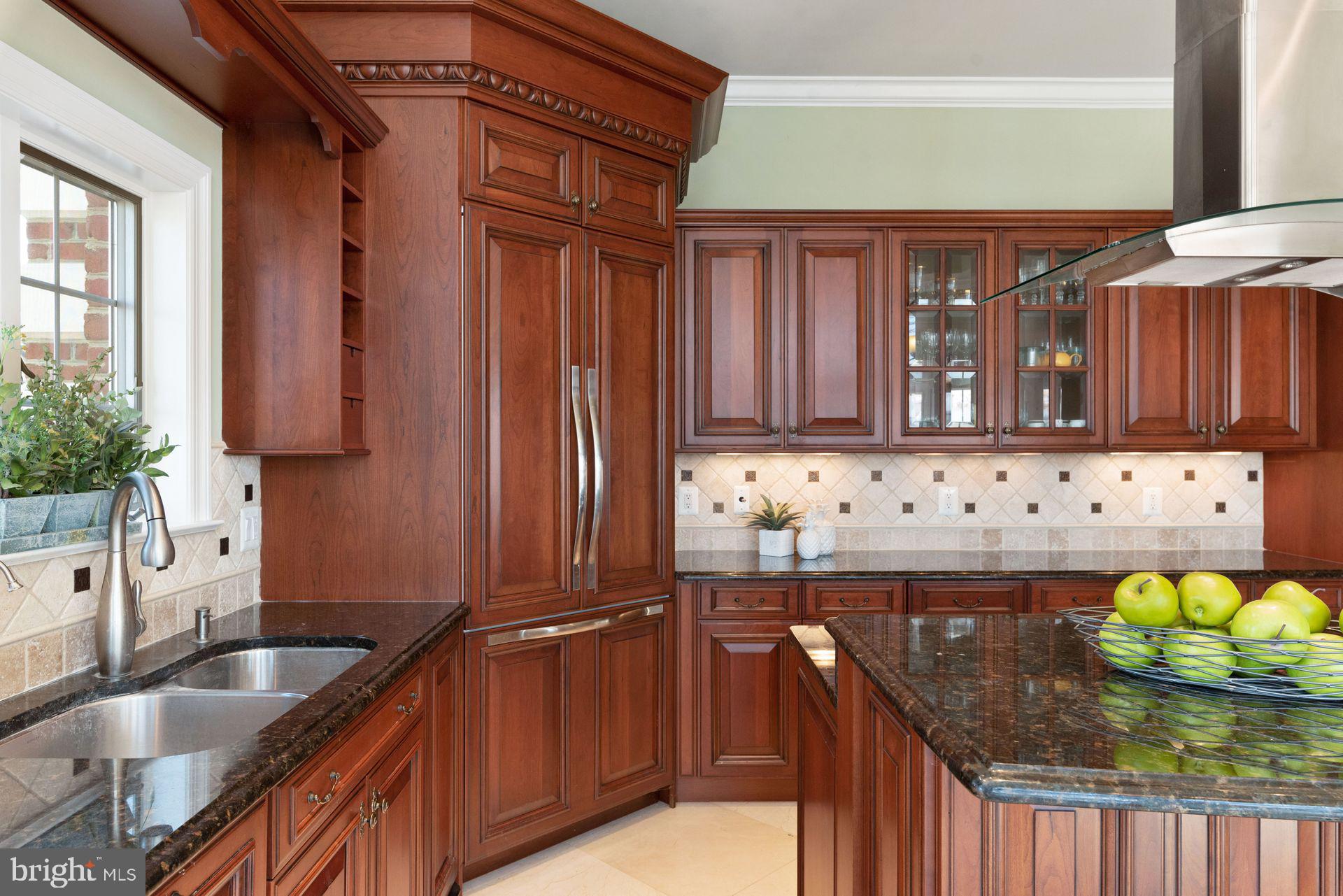 4132 Cadle Creek Road Edgewater, MD 21037 - Photo 22 of 85 a kitchen with stainless steel appliances granite countertop a sink and a stove