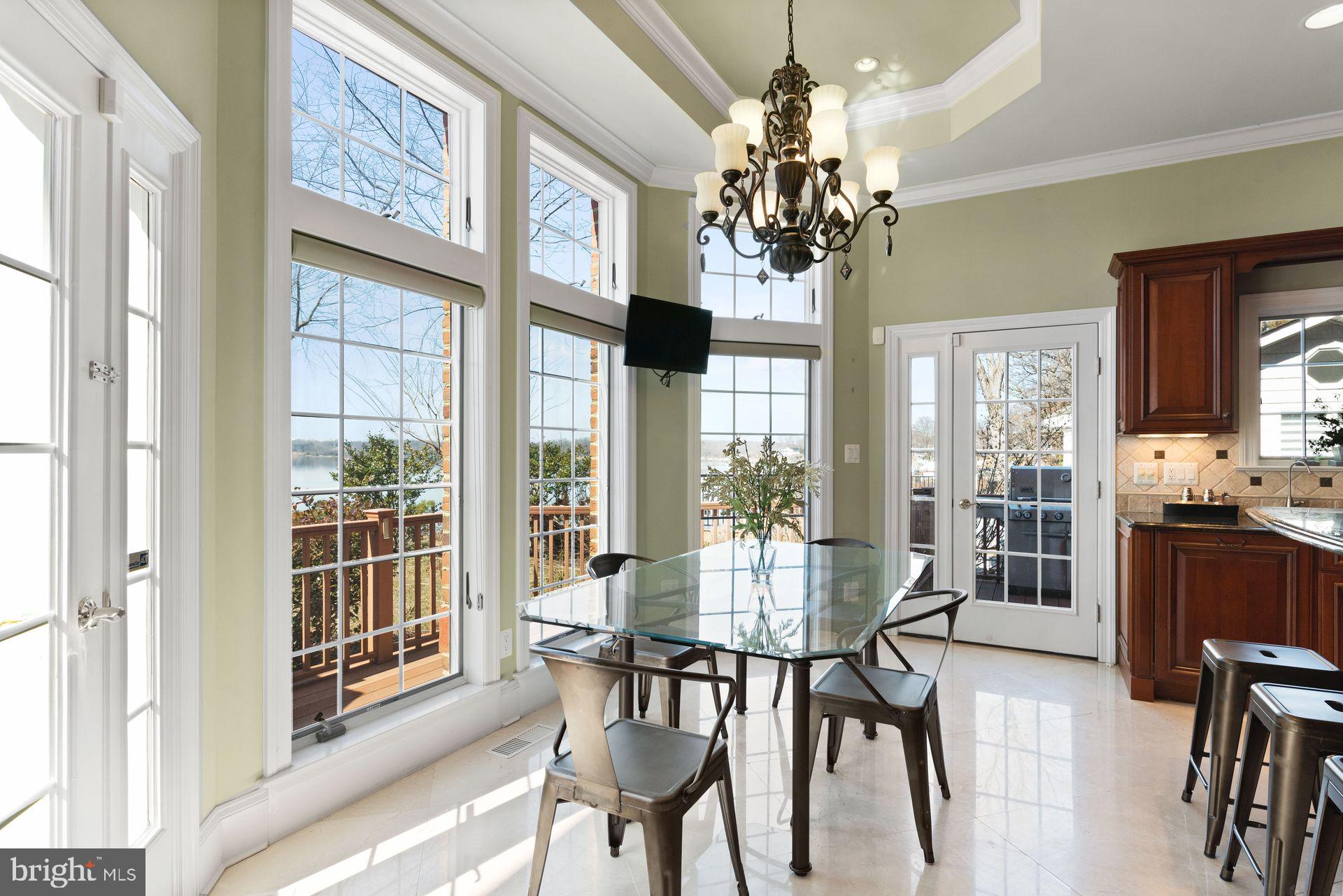 4132 Cadle Creek Road Edgewater, MD 21037 - Photo 24 of 85 a view of a dining room with furniture window and outside view