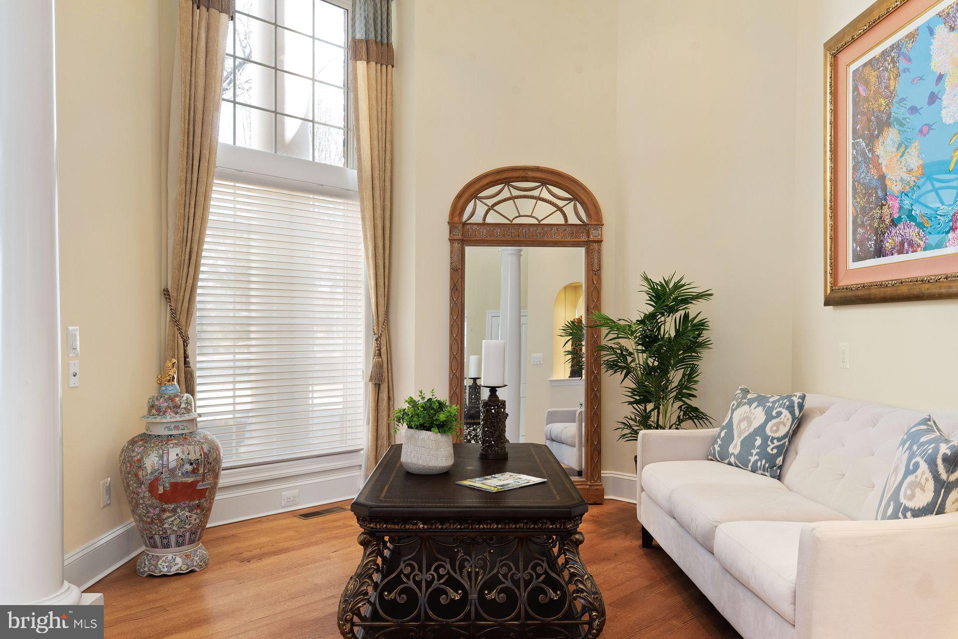 4132 Cadle Creek Road Edgewater, MD 21037 - Photo 29 of 85 a living room with furniture and a potted plant
