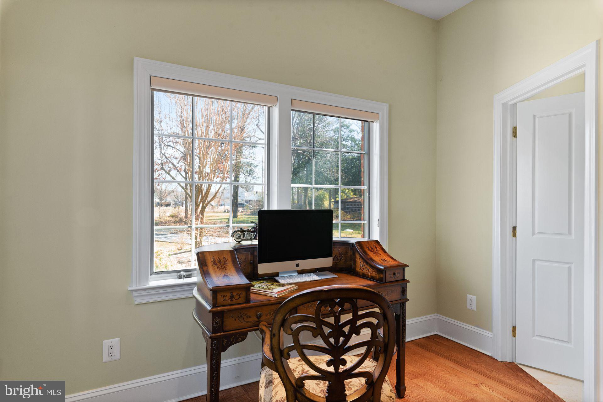 4132 Cadle Creek Road Edgewater, MD 21037 - Photo 38 of 85 a view of a workspace with furniture and a window